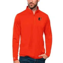 Men's Baltimore Orioles Antigua Orange Tribute Quarter-Zip Pullover Top